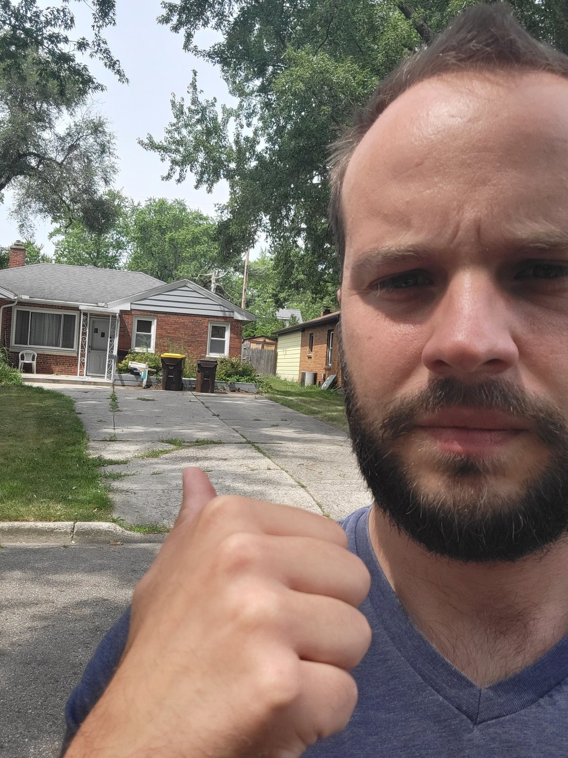 Alex Craig reviewing a Greater Lansing property