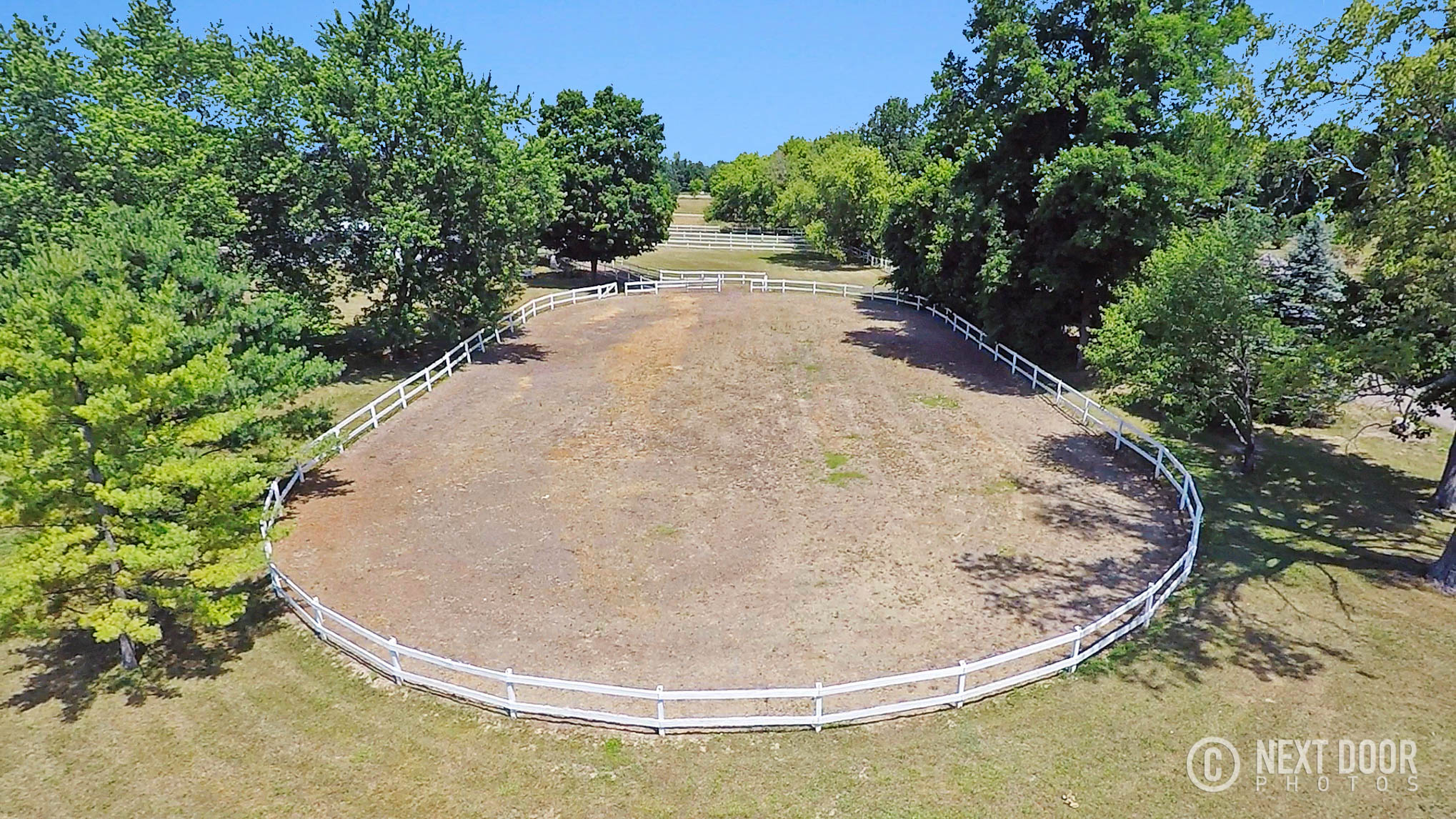 Aerial arena and fencing at a Michigan horse property